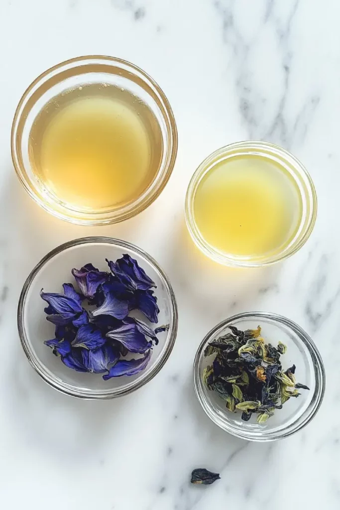 Ingredients for Brazilian Mounjaro butterfly pea flowers recipe including ginger, dried butterfly pea flowers, green tea, and lemon peel